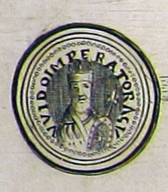 A historical seal depicting a figure crowned, symbolizing imperial authority, with Latin inscription around the edge.