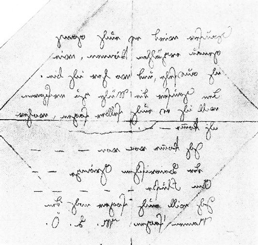 A handwritten note in German, crumpled and folded, containing text that appears ambiguous and difficult to read.
