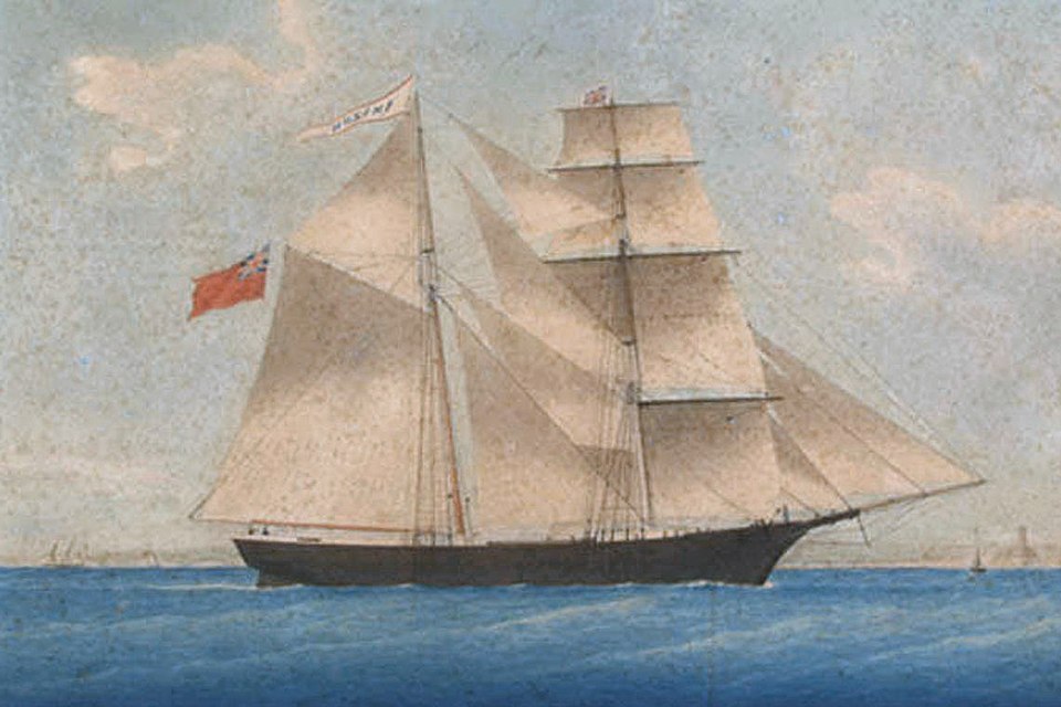 A painting of the American merchant ship Mary Celeste, a brigantine with sails set, sailing in the Atlantic Ocean.
